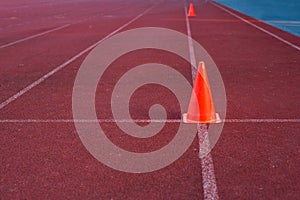 Orange cone on racetrack used in practice run