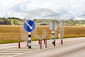 Orange cones and road signs for traffic control on the highway