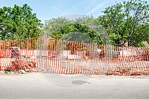 Orange construction site barrier or fence net to protect working place