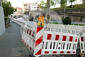 Orange construction Street barrier light on barricade. Road cons