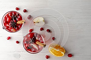 Orange and cranberry punch with orange slices and spices. Top view