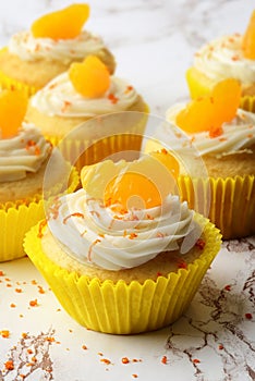 Orange cream cupcake with peel