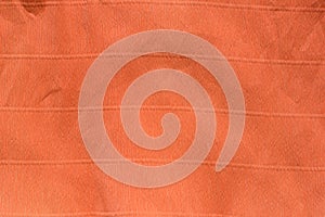 Orange creased crepe paper background texture