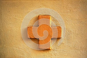 Orange cross on a wall