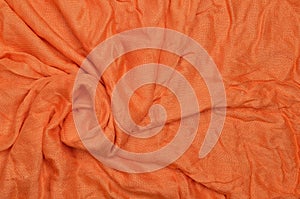 Orange crumpled textile background