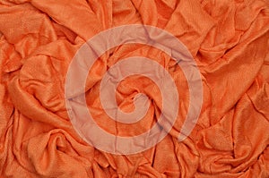 Orange crumpled textile background