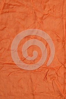 Orange crumpled textile background