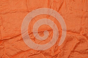 Orange crumpled textile background