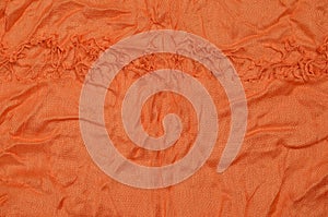 Orange crumpled textile background