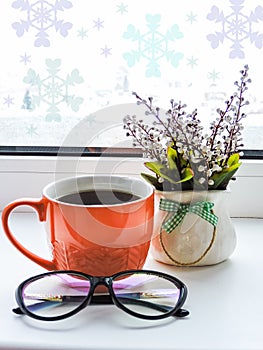 Orange cup of coffee on white  background with glasses. Flat lay style.Break time Coffee Cup Concept.