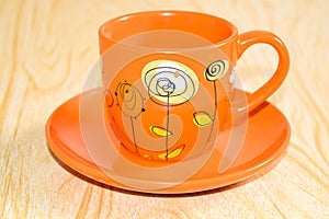 Orange Cup on a saucer