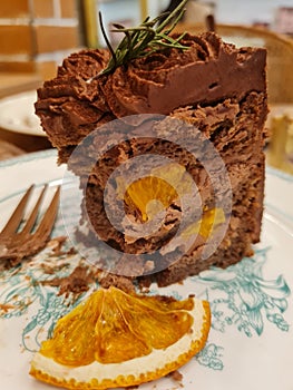 Orange dark chocolate sliced cake with dried sweet orange