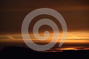 orange dawn on black hills