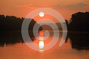 Orange dawn over the great Siberian river Biya