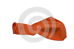 Orange deflated rubber balloon