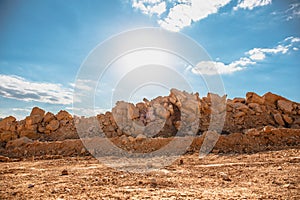 Orange desert sand stones and bright blue cloudy sky. Hipster retro toned landscape