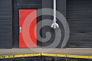 Orange Door, White Pipe, and Black Warehouse Wall, Portland, Oregon