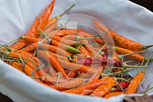 Orange Dried Chili Peppers inside White Bowl