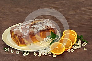 Orange Drizzle Cake with Fruit and Spring Blossom photo