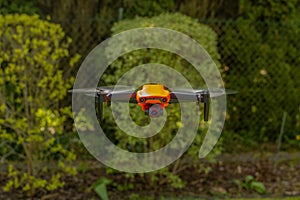 Orange drone in flight, Poland.