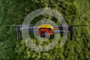 Orange drone in flight, Poland.