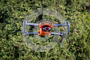 Orange drone in flight, Poland.