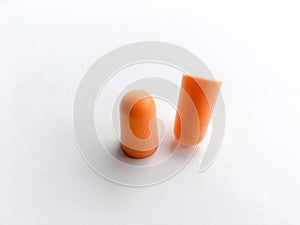 Orange ear plugs alignment on white background