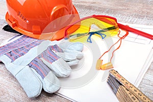 Orange earplug , hard hat, safety glasses, gloves. Earplug to reduce noise on a white background .