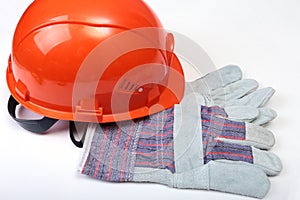 Orange earplug , hard hat, safety glasses, gloves. Earplug to reduce noise on a white background. you can place your