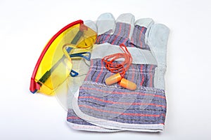 Orange earplug , hard hat, safety glasses, gloves. Earplug to reduce noise on a white background. you can place your