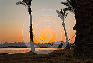 Orange Egyptian Sunset over the mountains and Red Sea resort with reflection, Soma Bay, Hurghada, Egypt