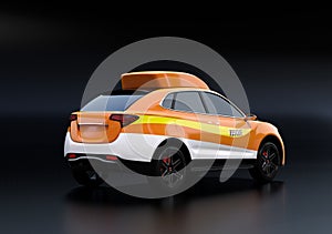 Orange electric rescue SUV isolated on black background