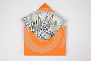 orange envelope with dollars isolated on a white background