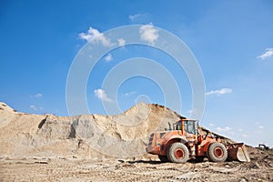 Orange excavator on a construction site