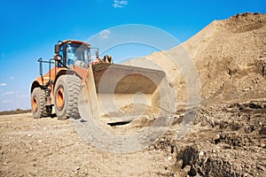 Orange excavator on a construction site