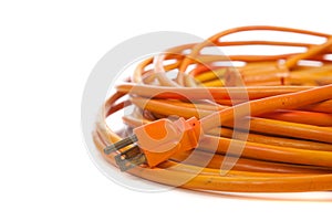 An orange extension cord on white