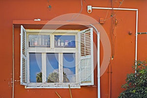 Orange facade and white shutters in Zichron Yaakov