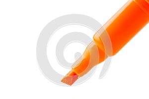 Orange felt-tip pen isolated on white background, close up