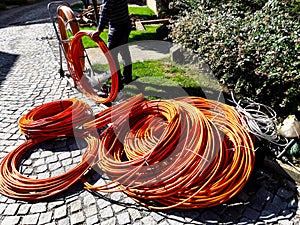 Orange fibre or fiber optic cables at garden for excavation