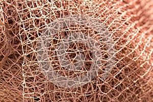 Orange fishnet texture. Close up pattern
