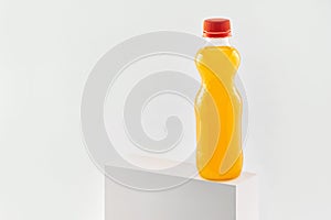 Orange fizzy drink in a plastic bottle isolated