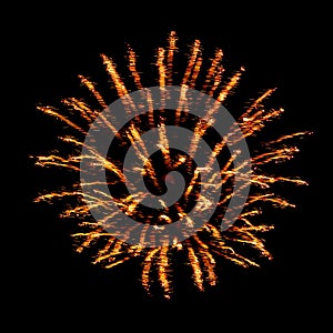 Orange flash and sparks from fireworks isolated on black background