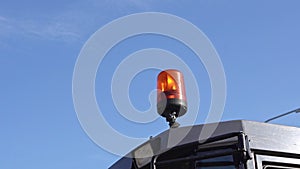orange flashing beacon sparkling on the roof of special vehicles