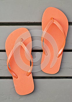 Orange Flip Flops on the Deck