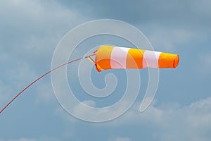 Orange fluorescent weather vane closeup