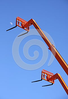 Orange Forklifts and Moon