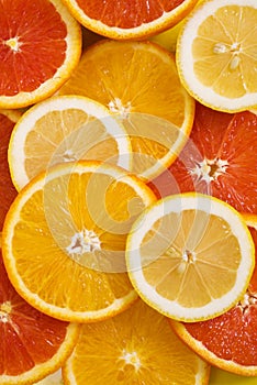 Orange fruit background with lemon and red orange