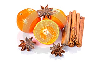 Orange fruit, cinnamon sticks and anise stars