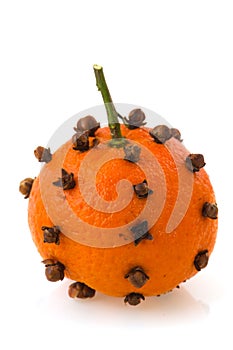 Orange fruit with cloves