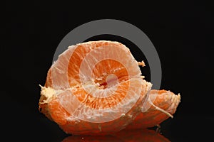 Orange fruit isolated on black